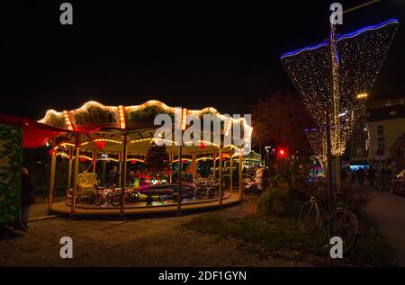 Graz, Austria - November 22, 2019: Vintage carousel and beautiful Christmas decorations at night, in the city center of Graz, Styria region, Austria Stock Photo