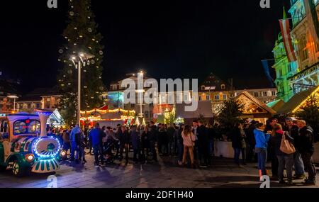 Graz, Austria - November 22, 2019: Beautiful Christmas decorations at crowded Hauptplatz (main square), at night, in the city center of Graz, Styria r Stock Photo