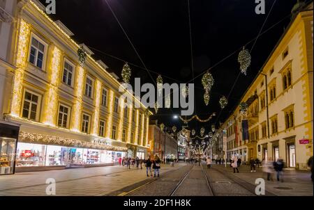 Graz, Austria - November 22, 2019: beautiful Christmas decorations on famous Herrengasse street, at night, in the city center of Graz, Styria region, Stock Photo