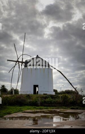 Dramatic landscape with a windmill on a stormy day in Vejer, Spain. Stock Photo