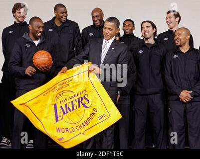 File photo dated December 13, 2010 of U.S. President Barack Obama (C) receives an autographed championship flag and basketball from members of the Los Angeles Lakers (L-R) Paul Gasol, Kobe Bryant, Andrew Bynum, Lamar Odom, Ron Artest, Aleksandar Vujacic, Luke Walton and Derek Fisher during an event at the Boys and Girls Club at THEARC in Washington, DC, USA. US basketball legend Kobe Bryant and his daughter Gianna are among nine people killed in a helicopter crash in the city of Calabasas, California. Bryant, 41, and Gianna, 13, were travelling in a private helicopter when it came down and bur Stock Photo