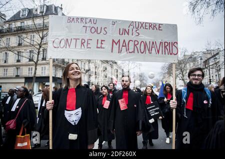 Protesters hold banners and chant slogans during a demonstration called by the 'SOS Retraites' collective, gathering lawyers, doctors, nurses, pilots and other independent workers, to protest the French government's reform of the pension system, on February 3, 2020, in Paris, France. Photo by Magali Cohen/ABACAPRESS.COM Stock Photo