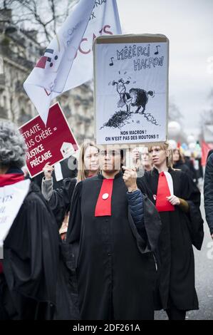 Protesters hold banners and chant slogans during a demonstration called by the 'SOS Retraites' collective, gathering lawyers, doctors, nurses, pilots and other independent workers, to protest the French government's reform of the pension system, on February 3, 2020, in Paris, France. Photo by Magali Cohen/ABACAPRESS.COM Stock Photo