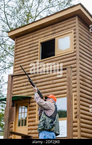 Alabama Town Creek Doublehead Resort clay pigeon range shooting practice,guide man gun aims aiming, Stock Photo