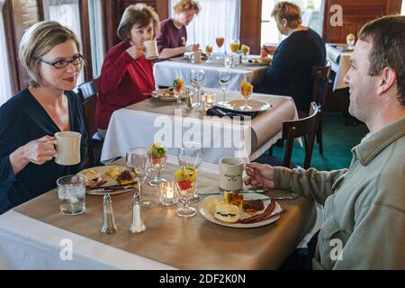 Alabama Mentone Mentone Inn Bed & Breakfast B&B,guests couple eating inside interior, Stock Photo
