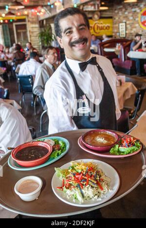 Huntsville Alabama,Rosie's Mexican Cantina,restaurant inside interior dining,Hispanic man waiter server employee working worker,balances balancing tra Stock Photo