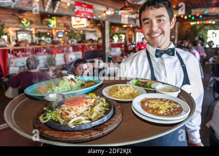 Huntsville Alabama,Rosie's Mexican Cantina,restaurant inside interior dining,Hispanic man waiter server employee working worker,balances balancing tra Stock Photo