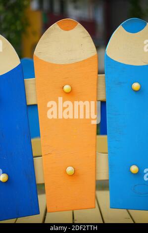 Large wooden pieces in the shape of pencils with different colors Stock Photo