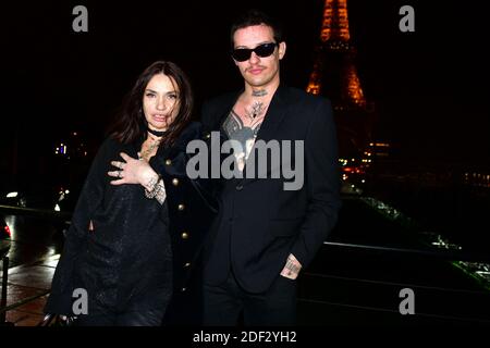 Beatrice Dalle and Paul Bichet attend the Saint Laurent show as