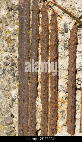 A vertical shot of rusted metal stripes on the wall Stock Photo