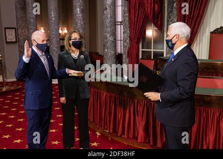 Vice President Mike Pence conducts a mock swearing in ceremony of Senator elect Mark Kelly, D-AZ, accompanied by his wife, Gabrielle Giffords, in the Old Senate Chamber on Capitol Hill, in Washington, DC, Wednesday, December 2nd, 2020.Credit: Graeme Jennings/Pool via CNP | usage worldwide Stock Photo