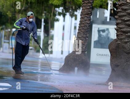 NO FILM, NO VIDEO, NO TV, NO DOCUMENTARY - Xavier Zamora, a City of Miami Beach employee, sanitizes the sidewalks at Lincoln Road early Tuesday morning, March 31, 2020. Photo by Pedro Portal/Miami Herald/TNS/ABACAPRESS.COM Stock Photo