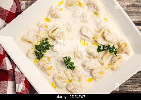 Tortellini with chicken and parma ham Stock Photo