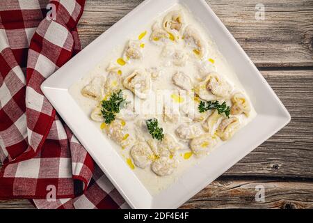 Tortellini with chicken and parma ham Stock Photo