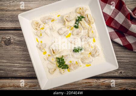Tortellini with chicken and parma ham Stock Photo