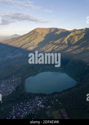 aerial view the beauty of Menjer Lake against the background of Mount Sindoro. tourist destination 'Hill of Love, Seroja Valley' Wonosobo, Central Jav Stock Photo