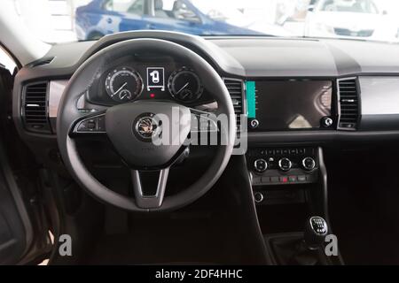 The place of driving a car inside the cabin with a steering wheel and a dashboard. Stock Photo