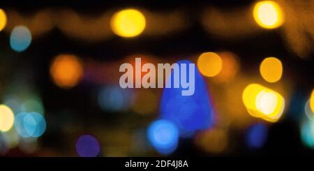 winter holidays background. garlands on the street with bokeh effect Stock Photo