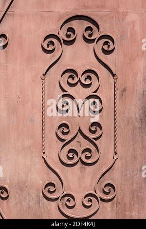 Metallic decor on a metallic brown painted door. Stock Photo