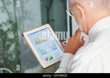 Company CEO analyzing sales Stock Photo