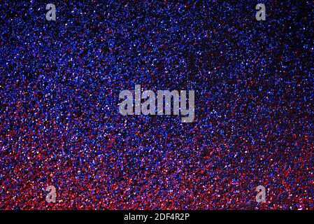 Neon shiny glitter texture background purple and blue. Luxury glow surface gradient backdrop. Color glistering dust. Stock Photo