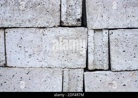 White concrete bricks closeup photo texture. Concrete block surface. Rough grey stone brick. Masonry wall made of big block. Rustic stone texture. Ind Stock Photo