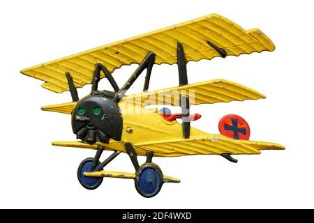 Antique embossed relief decoration, generic Great War (First World War) yellow toy airplane, isolated on white background Stock Photo