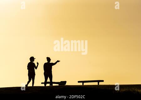 Huntington Beach, United States. 02nd Dec, 2020. People enjoy the sunset in Huntington Beach, California. Huntington Beach a travel destination in Southern California also known as Surf City USA. Credit: SOPA Images Limited/Alamy Live News Stock Photo