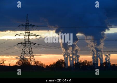 giant cooling towers and electricity pylons at drax power station at sunset united kngdom Stock Photo