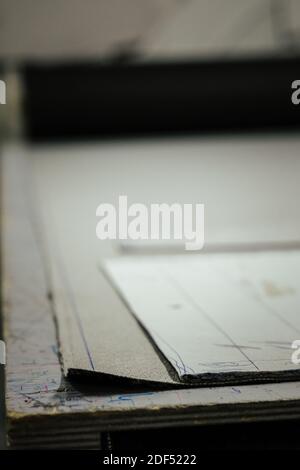 A vertical shot of architectural drawings on table Stock Photo
