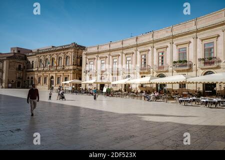 Ortigia in Syracuse Sicily Italy October 2020 in the Morning. Travel Photography from Syracuse, Italy on the island of Sicily. Cathedral Plaza and market with people wearing face protection during the 2020 pandemic covid 19 corona virus Stock Photo