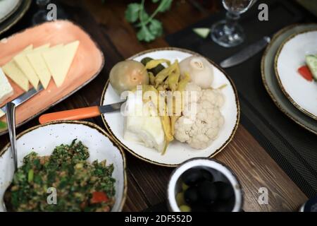 Georgian appetizers and salad on table in restaurant Stock Photo