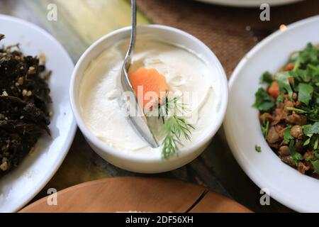 Bowl with cream on table in armenian restaurant Stock Photo