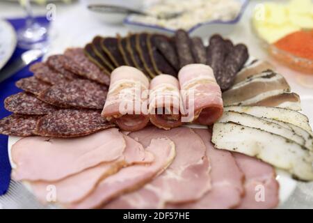 Sliced ham and sausages on a plate Stock Photo