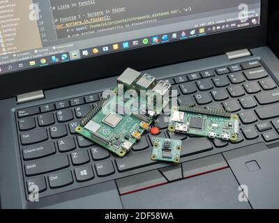 Galati, ROMANIA - November 02, 2020: Close-up of Raspberry Pi 4 Model-B and Raspberry Pi Zero W on a laptop keyboard. The Raspberry Pi is a credit-car Stock Photo