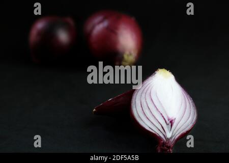 Red onions isolated on black background Stock Photo