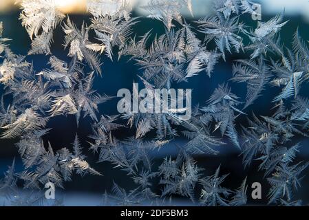 Beautiful natural frosty pattern on winter window. Ice pattern in winter time Stock Photo