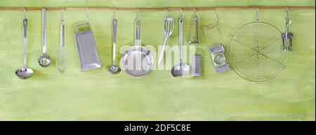 restaurant kitchen utensils on green painted wall, free copy space Stock Photo