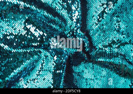 crumpled fabric sequins bleached coral glitter boke background texture Stock Photo