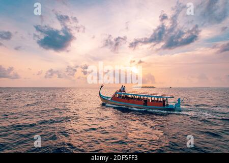 08.13.19 - Faafu Atoll, Maldives: Wonderful Maldivian boat Dhoni on tropical blue sea, taking tourist to a sunset cruise. Travel tourism exotic Stock Photo