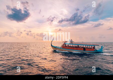 08.13.19 - Faafu Atoll, Maldives: Wonderful Maldivian boat Dhoni on tropical blue sea, taking tourist to a sunset cruise. Travel tourism exotic Stock Photo