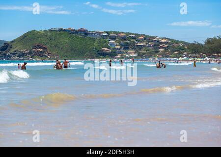 Buzios, Rio de Janeiro, Brazil – December 22, 2019: Praia da Geriba, Panoramic view of this beautiful beach. The people bathing in the turqoise water. Stock Photo