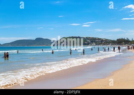 Buzios, Rio de Janeiro, Brazil – December 22, 2019: Praia da Geriba, Panoramic view of this beautiful beach. The people bathing in the turqoise water. Stock Photo