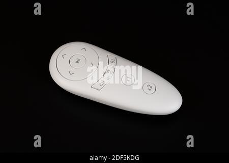 White remote control of windows cleaning robot on black background. Stock Photo