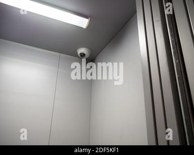 CCTV camera is installed on the ceiling of the elevator car Stock Photo