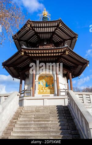 The Peace Pagoda in Battersea Park London England with gilded bronze gold Buddha statues which is a popular travel destination tourist attraction land Stock Photo