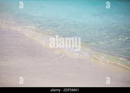 Simple sea sand waves concept. Tranquil tropical nature pattern, calm soft small waves splashing. Sea ocean environment Stock Photo