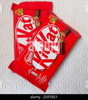 Two Nestle Kit Kat chocolate bar coated cream filled wafer snack. Bars Kit Kat is produced by Nestle company Stock Photo