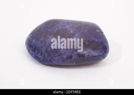 A sodalite gemstone shot on a white studio background Stock Photo