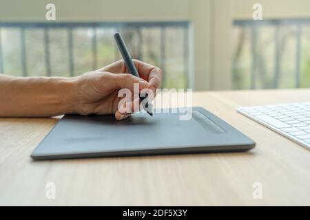 Video artist using graphics tablet. Stock Photo